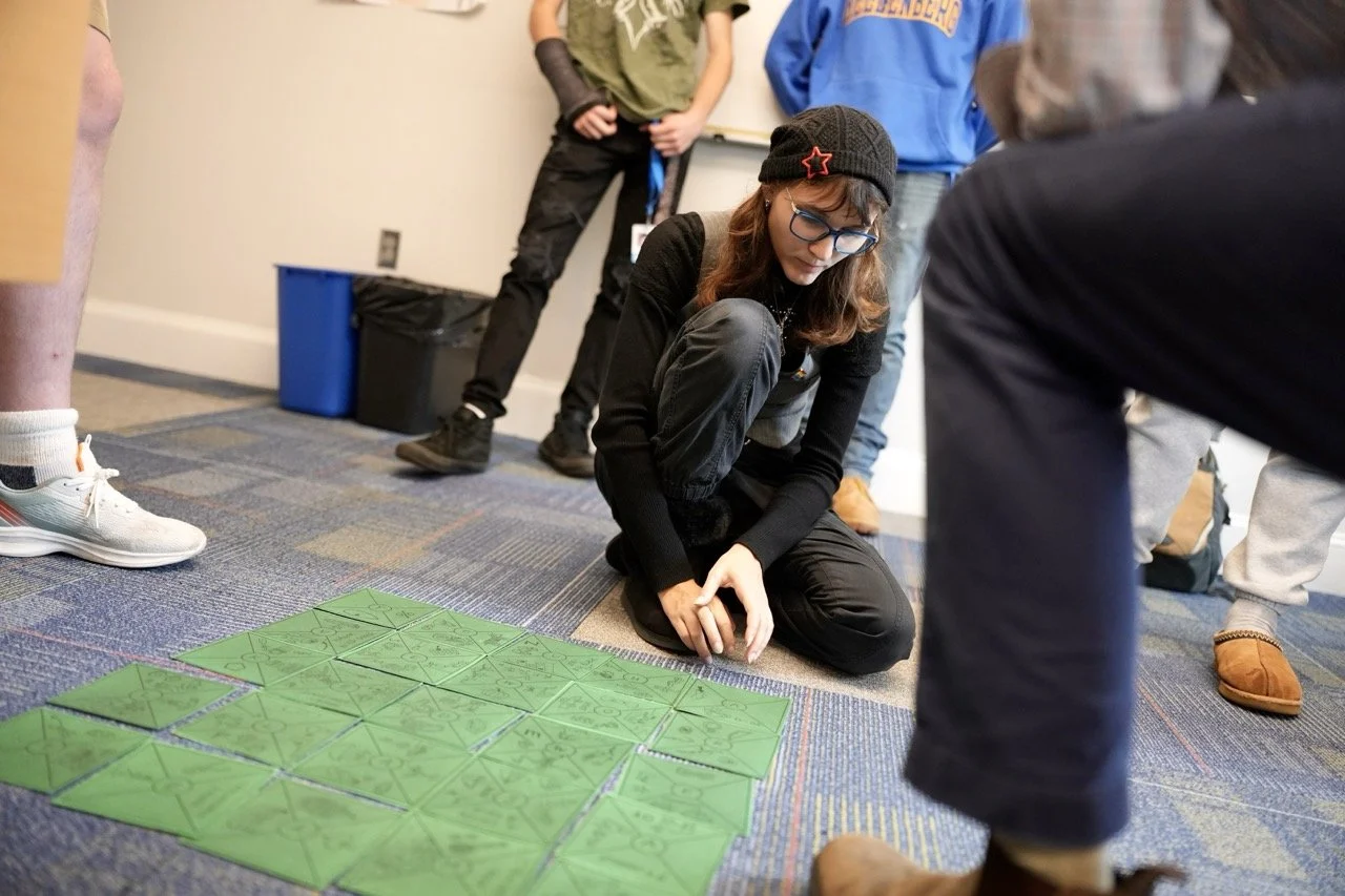 student kneeling